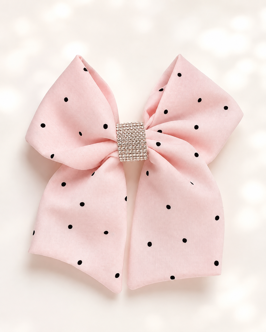 Front product view of Blushing Dottie Bow, 6-inch blush pink polka-dot hair bow