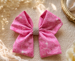 Front product view of Once Upon a Sparkle, 6-inch pink fabric hair bow