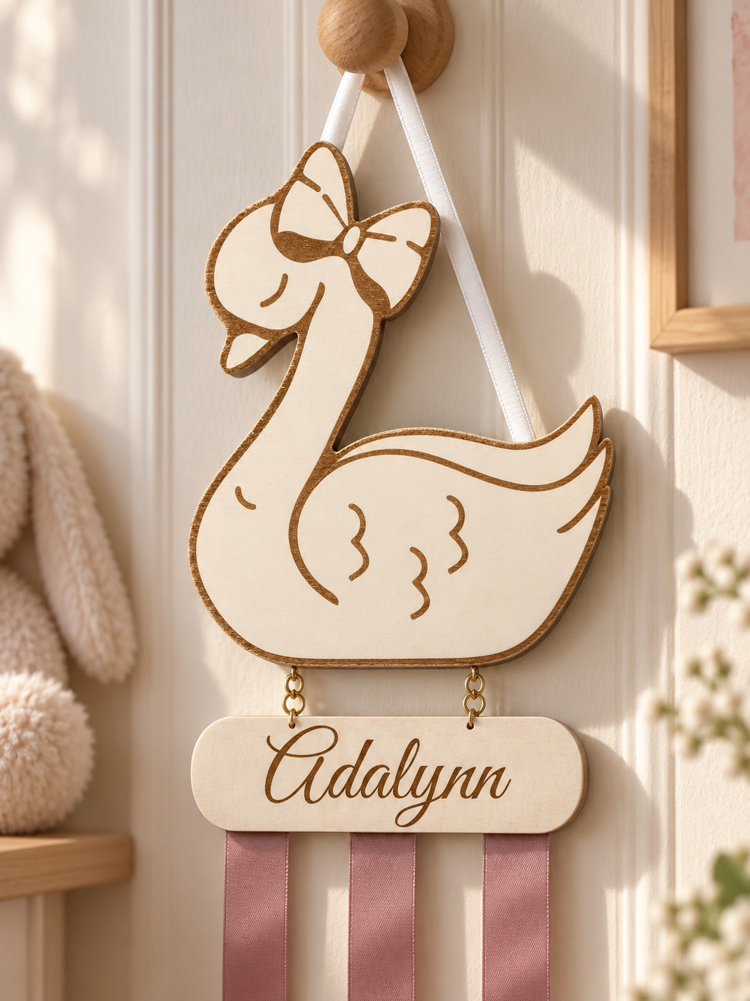 Close-up of wooden swan and personalized nameplate