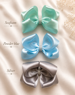 Back of The Rhinestone Everly Bow, approximately 5.5-inch satin hair bow showing the attached non-slip alligator clip