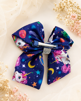 Starlit unicorn hair bow styled for girls birthday party and photo outfits