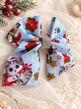 Girls Christmas cat boutique hair bow with poinsettias candy canes and gingerbread