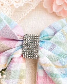 Close-up of Spring Picnic Bow, approximately 6-inch pastel plaid hair bow showing fabric and center detail