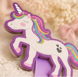 Close-up detail of the unicorn topper and lavender ribbon