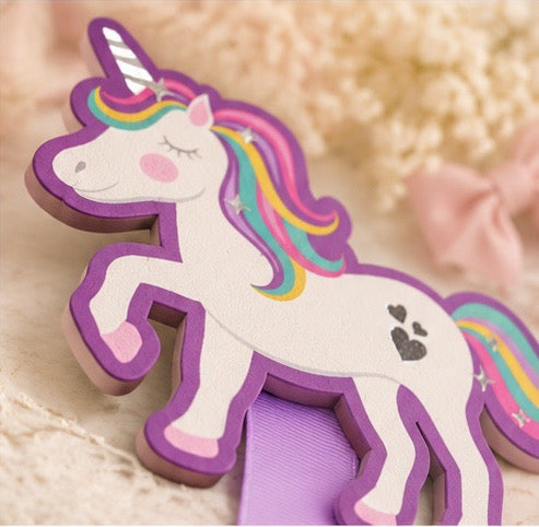 Close-up detail of the unicorn topper and lavender ribbon