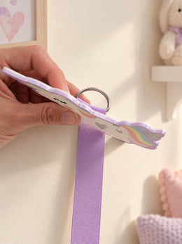Back view showing the D-ring attachment on the rainbow unicorn bow holder