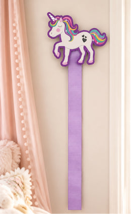 Rainbow unicorn bow holder with a 36-inch lavender ribbon displayed on a nursery wall