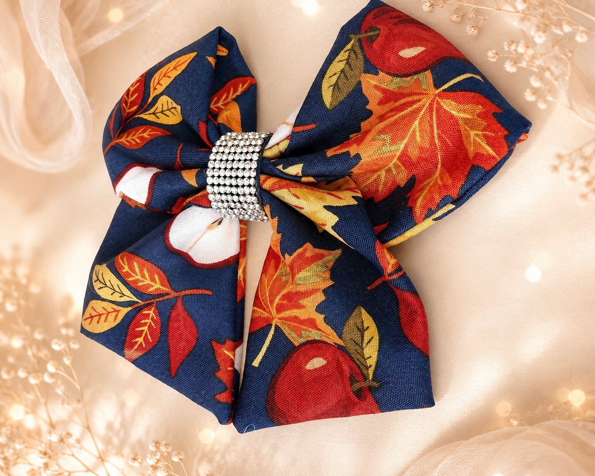 Apple Orchard, 6-inch fall hair bow held in hand to show size