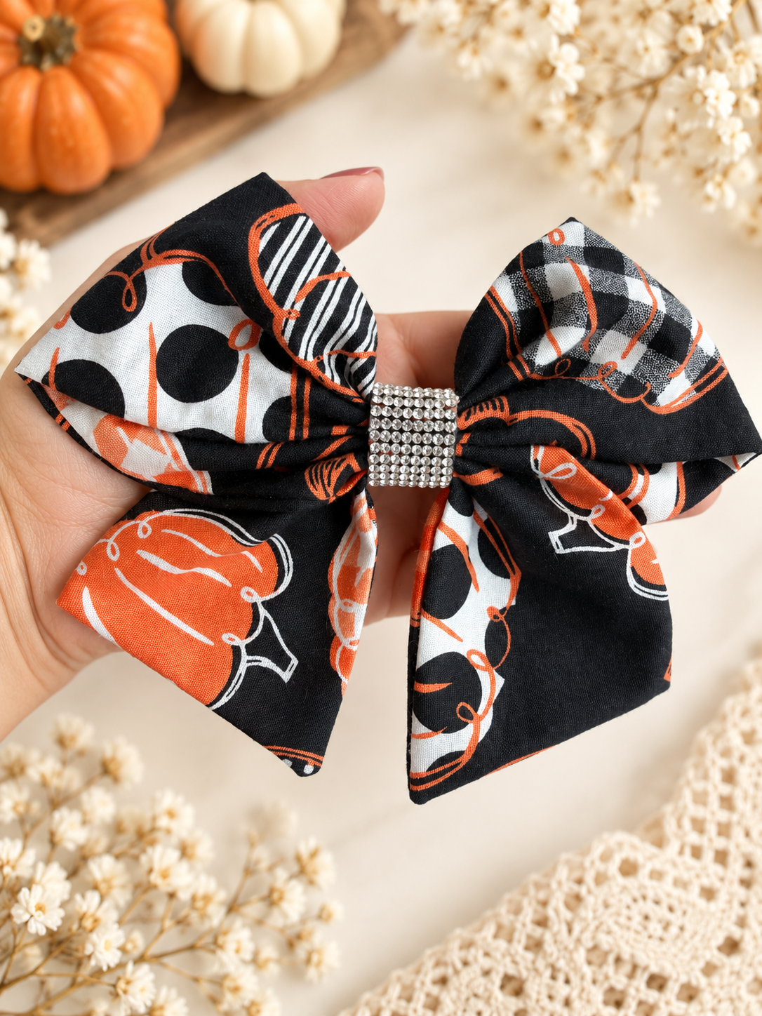 6 inch pumpkin hair bow for girls shown for size with rhinestone center
