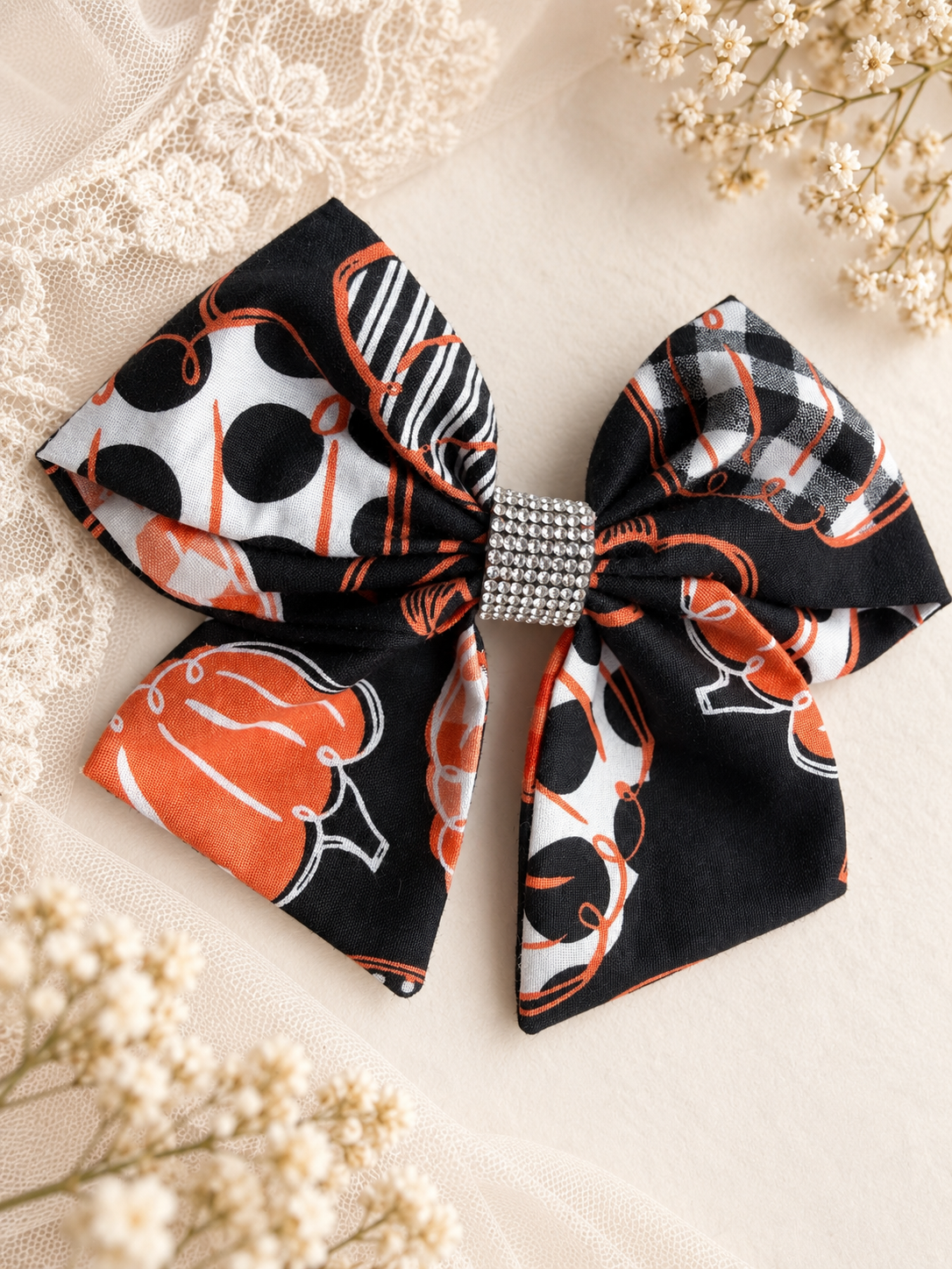 Black orange and white pumpkin 6 inch hair bow with rhinestone center