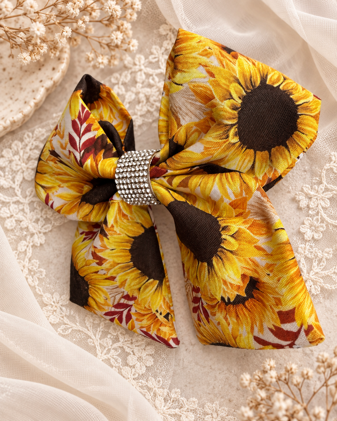 6 inch sunflower hair bow shown for size with warm fall colors
