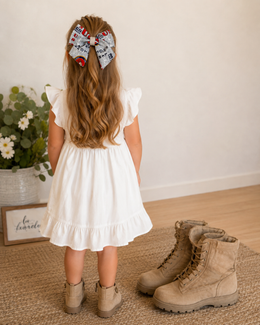 Styled flat lay of Semper Fi Darling Bow, approximately 6-inch Marine Corps-inspired hair bow