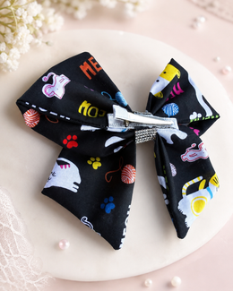 Black cat hair bow with rhinestone center for birthdays school and photos
