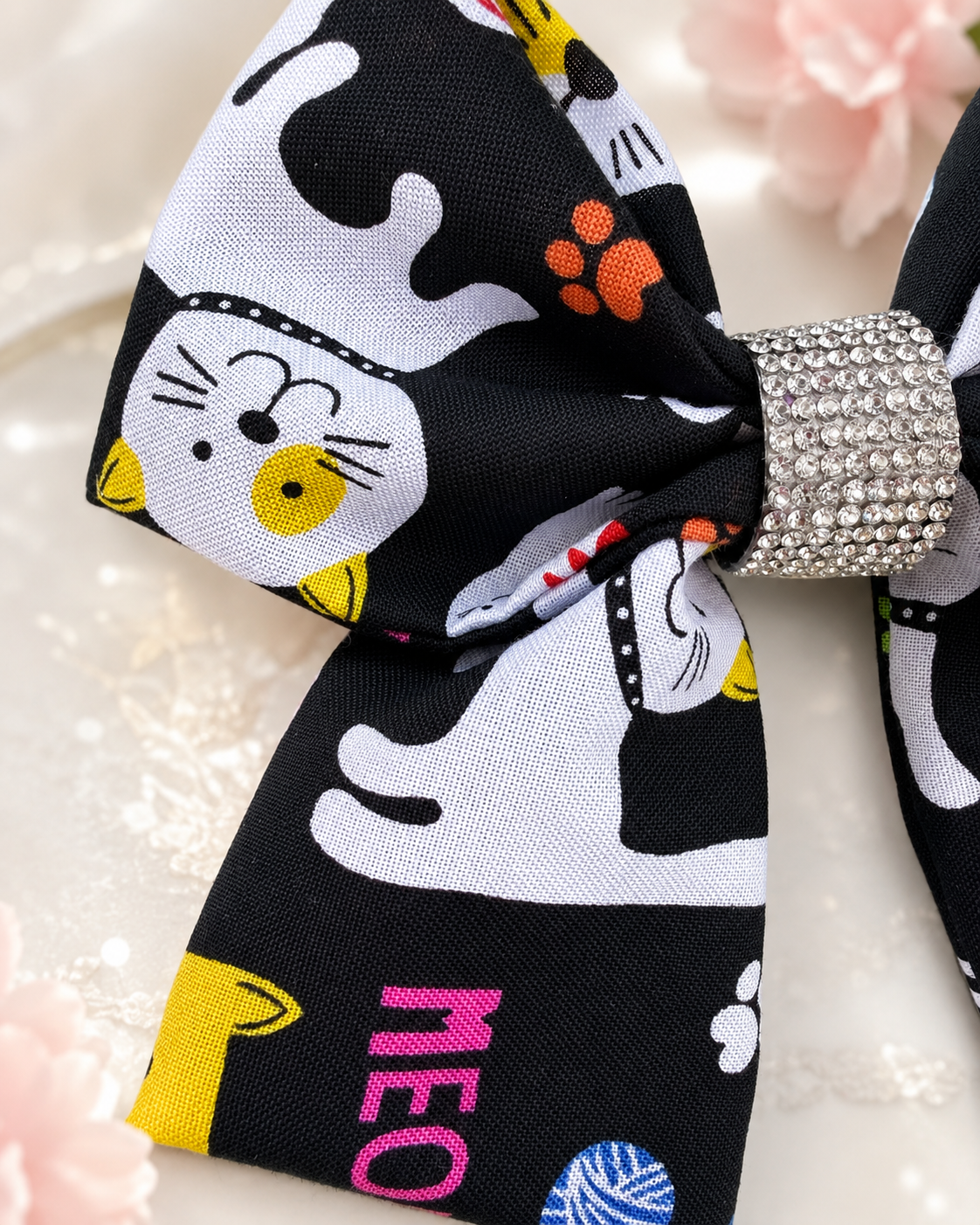 Black cat boutique hair bow with MEOW lettering and sparkling rhinestone center