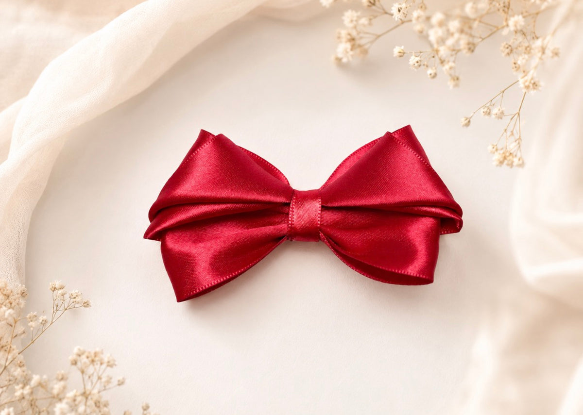 Front product view of Merry Little Magic, 3.5-inch red satin hair bow