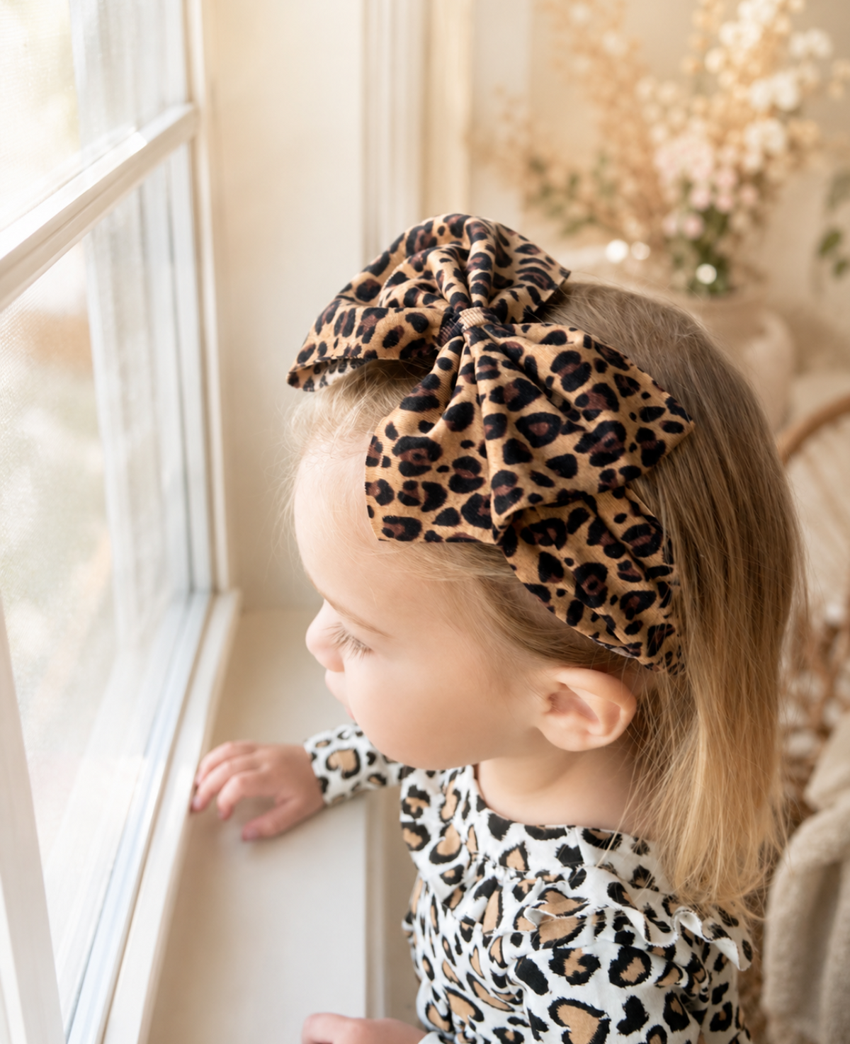 Little in Leopard, leopard bow headband worn in a girl's hairstyle to show scale
