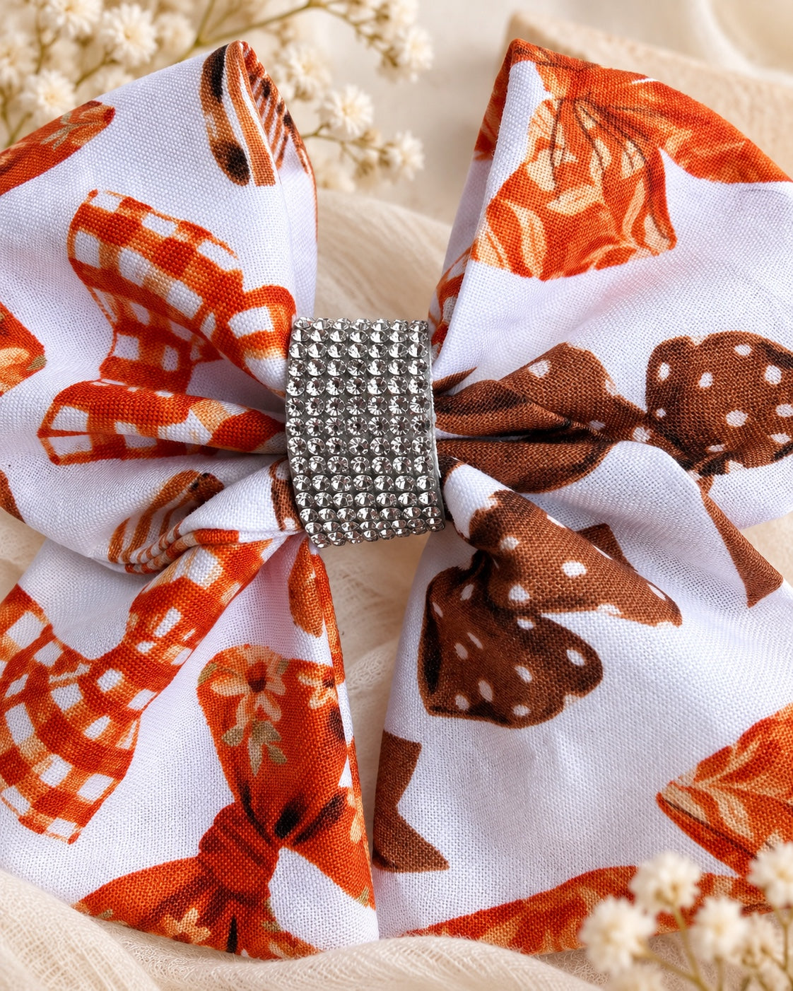 Autumn Ribbons 5.5 inch girls fall hair bow with rust orange and brown printed bows and rhinestone center