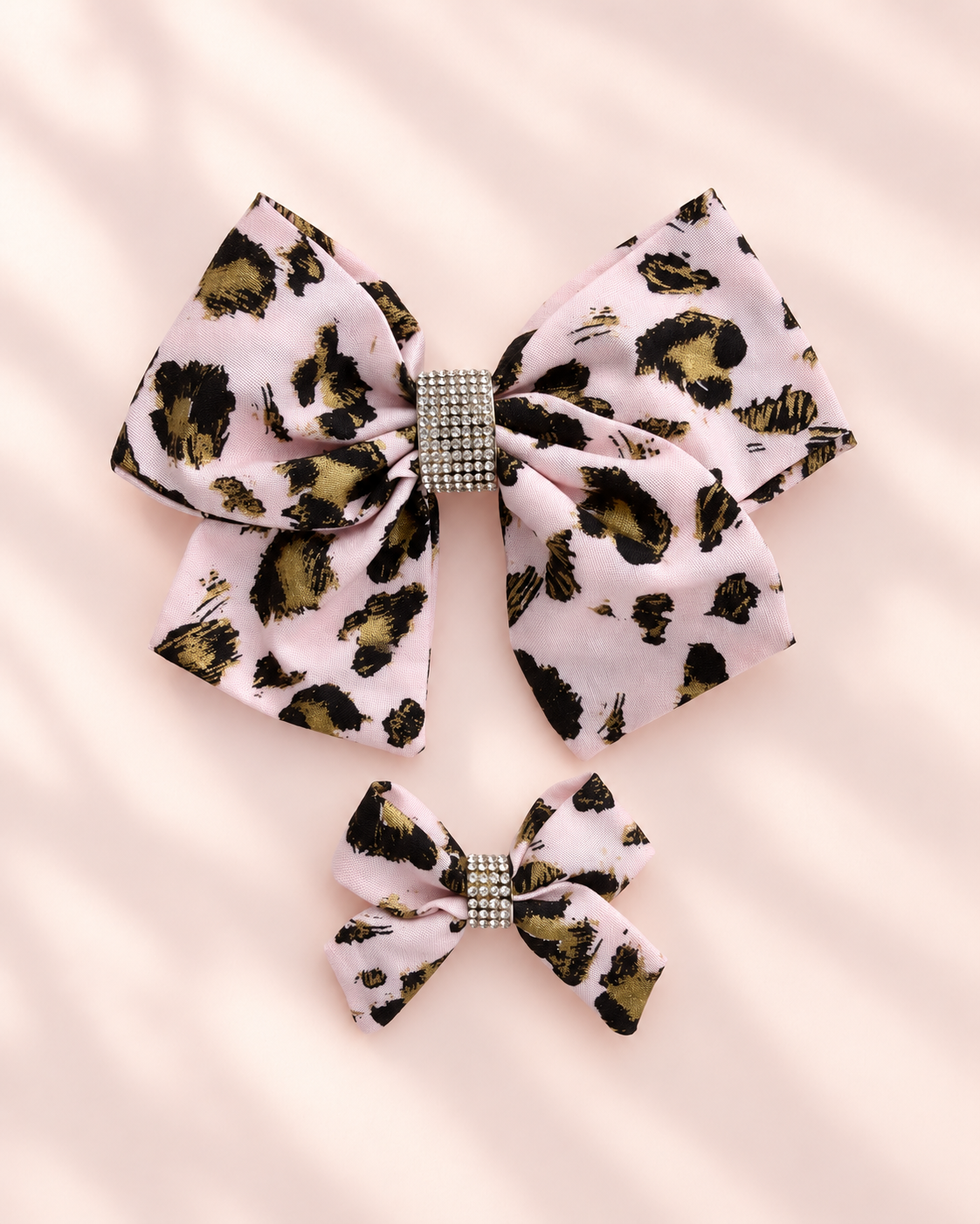 Matching blush pink leopard print rhinestone hair bows in 6 inch and 3 inch sizes