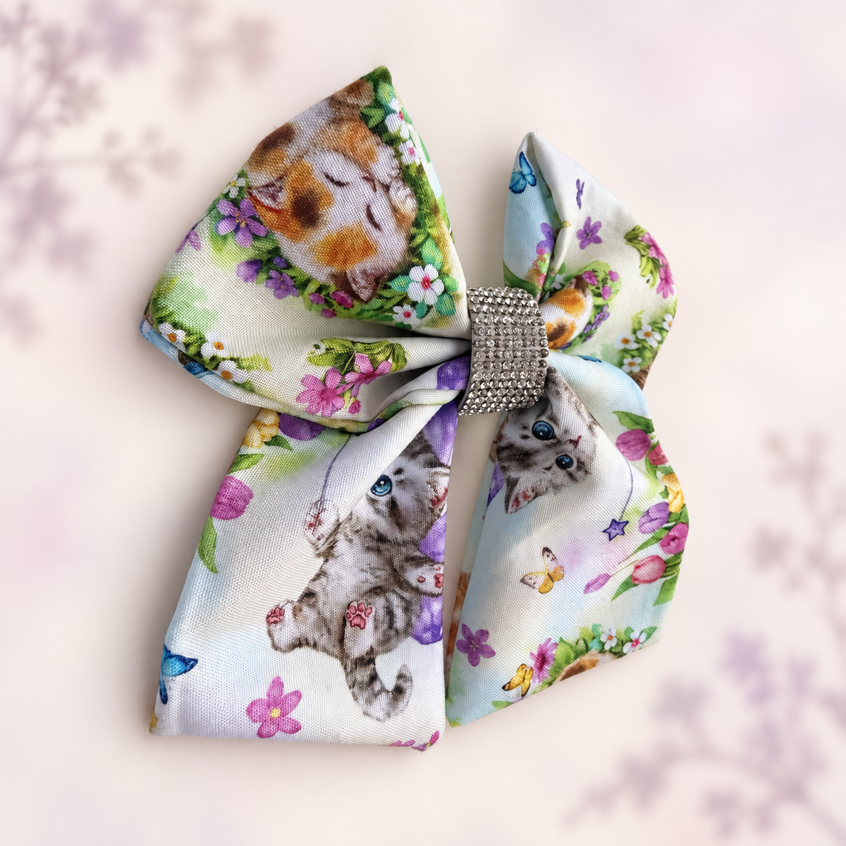 Large cotton kitten and flower hair bow for girls shown at an angle
