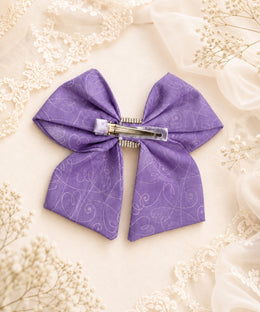Back view of lavender purple rhinestone hair bow showing attached alligator clip