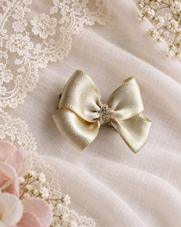 champagne satin mini hair bow on ivory lace with soft florals