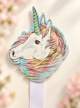 Close-up of the pastel unicorn head topper with mint horn and pink, yellow, and mint mane