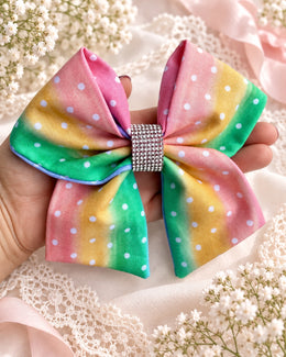 Back of pastel rainbow rhinestone hair bow with alligator clip